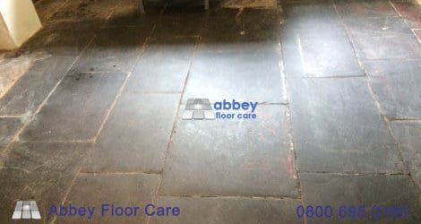 Paint, cement, lime residue and lost grout on an old slate floor in Corris